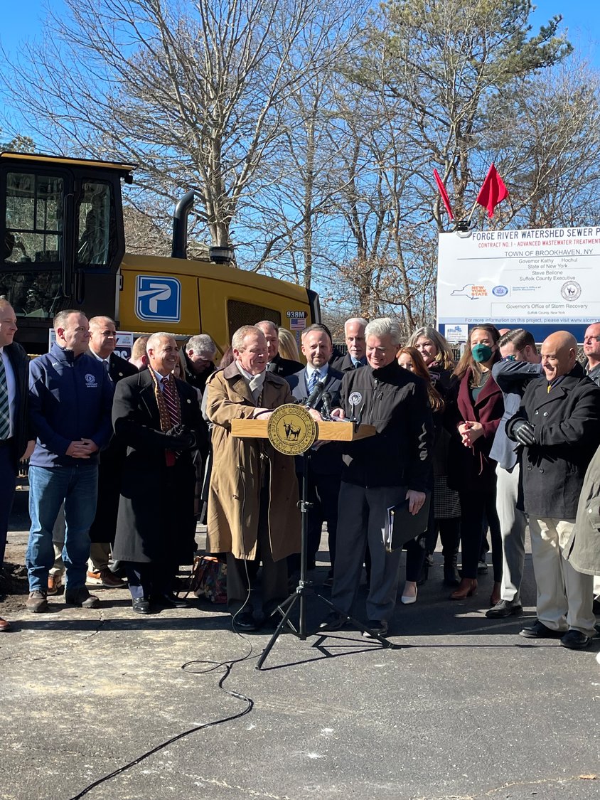 Suffolk County executive Steve Bellone gathers with officials for the groundbreaking of the Forge River wastewater treatment plant at the Mastic firehouse last week.